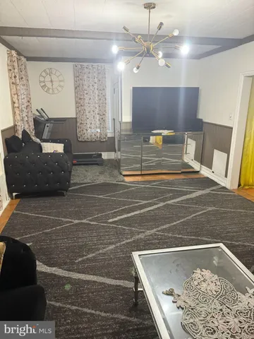 a spacious bathroom with a tub and mirror