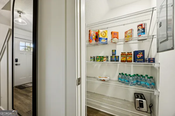 a kitchen with a refrigerator and a stove