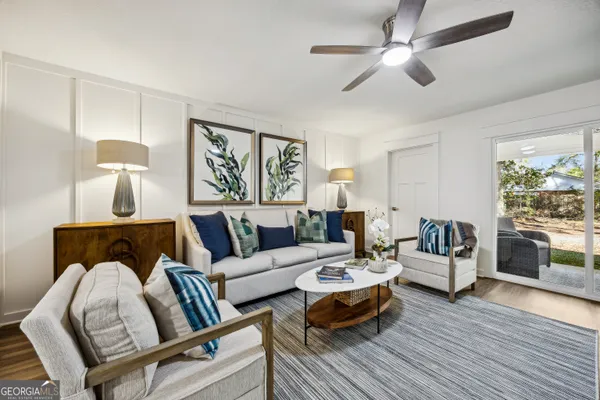 a living room with furniture fireplace and flat screen tv