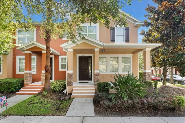 a front view of a house with garden