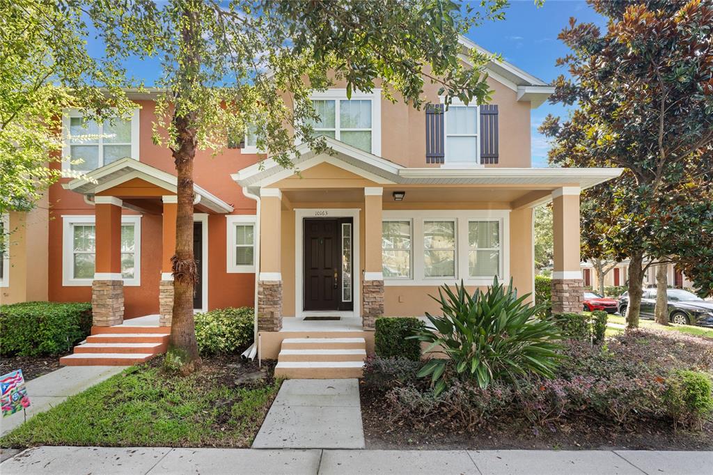 a front view of a house with garden