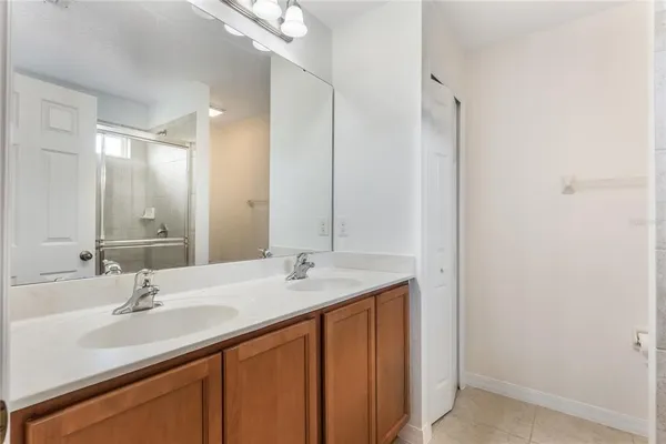 a bathroom with a sink double vanity and a mirror