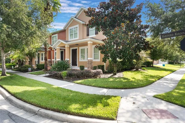a front view of a house with a yard