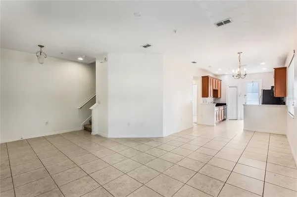 a view of a kitchen with white cabinets