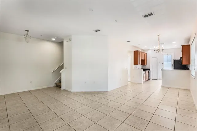 a view of a kitchen with white cabinets