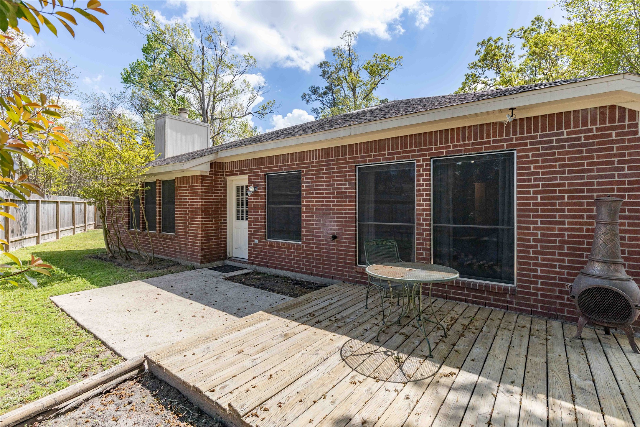 1707 Moston Drive Spring, TX 77386 - Photo 32 of 41 a view of a house with a large window and wooden fence
