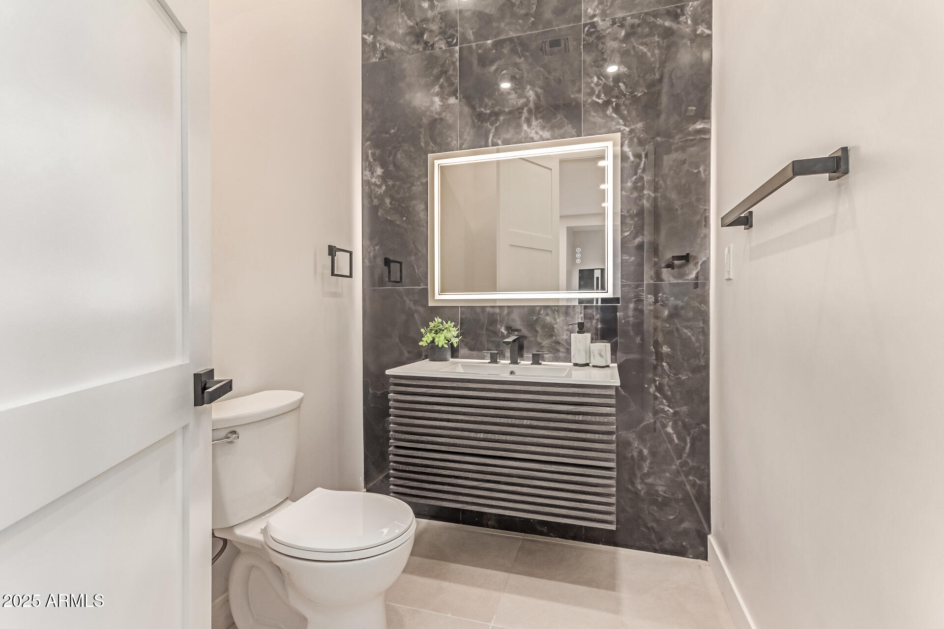 3301 East Rovey Avenue Paradise Valley, AZ 85253 - Photo 79 of 105 a bathroom with a sink a toilet and shower