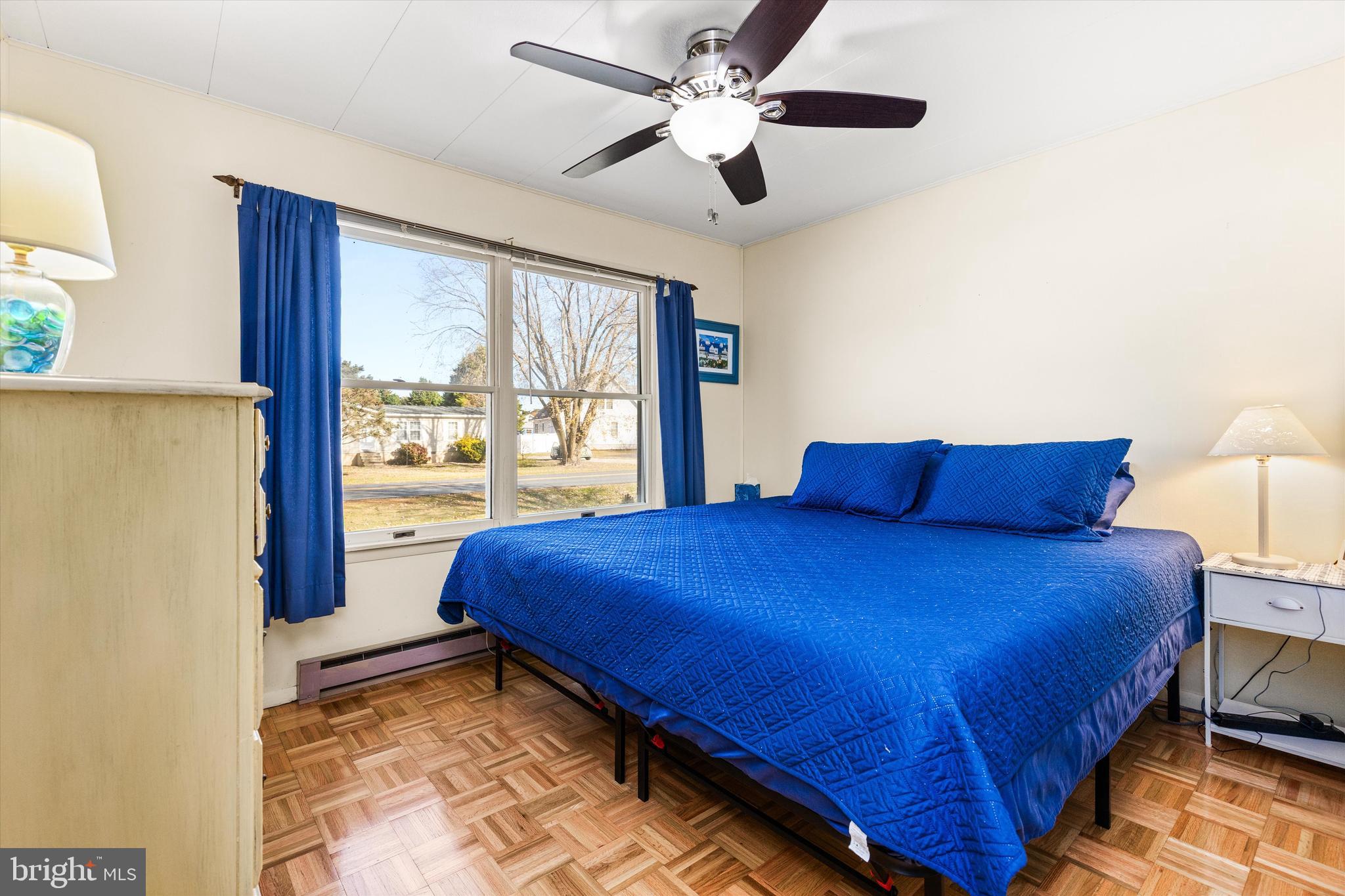 36466 Old Mill Road Ocean View, DE 19970 - Photo 14 of 36 Bedroom with king bed and hardwood floors