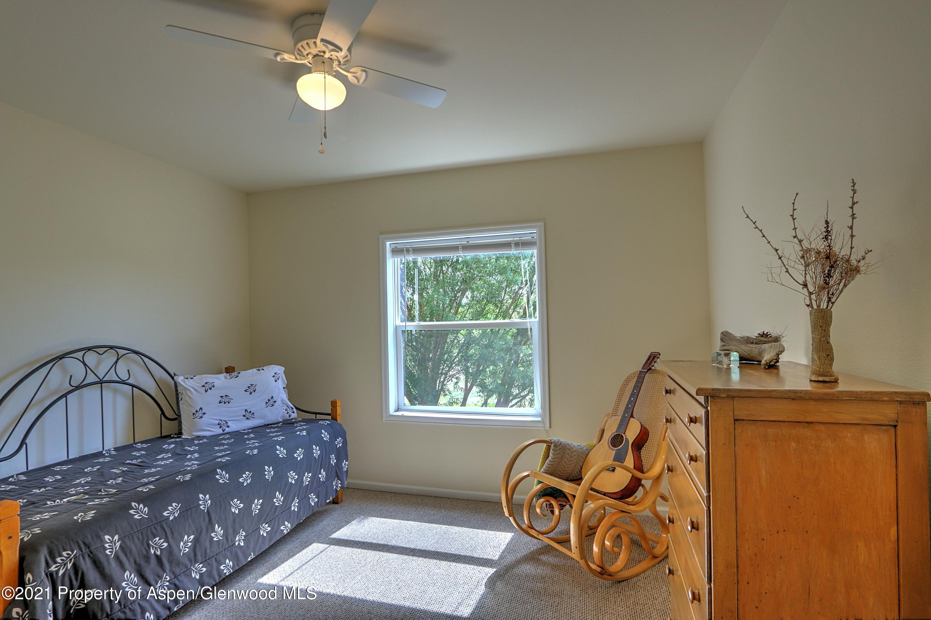 135 Swiss Lane Rifle, CO 81650 - Photo 16 of 46 a living room with furniture and a window