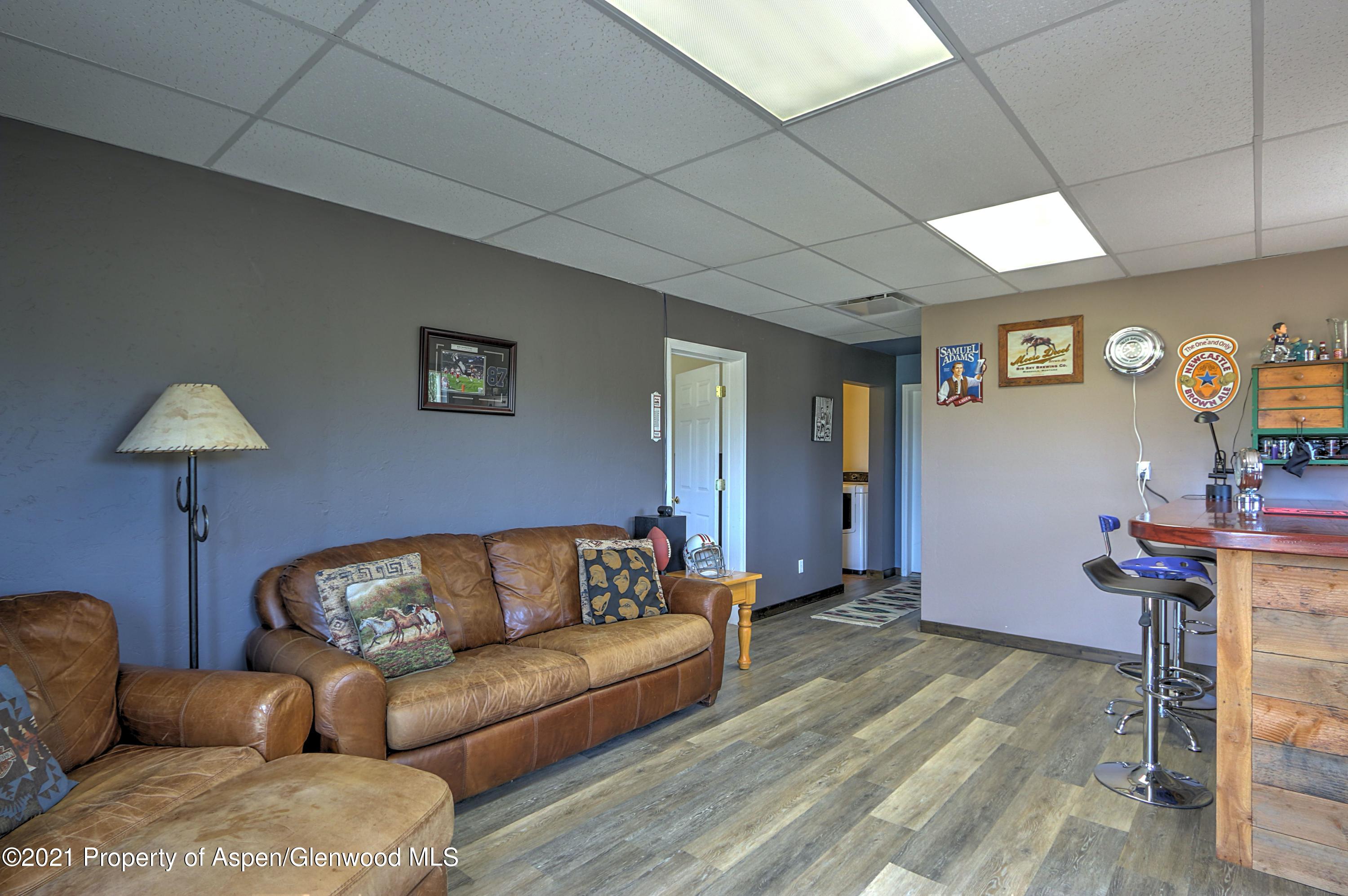 135 Swiss Lane Rifle, CO 81650 - Photo 19 of 46 a living room with furniture and a lamp