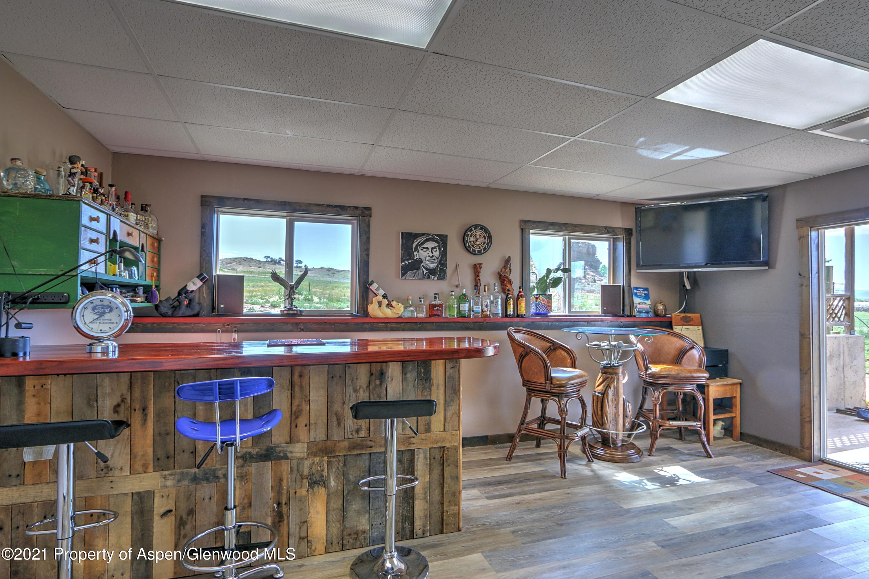 135 Swiss Lane Rifle, CO 81650 - Photo 20 of 46 a kitchen with stainless steel appliances a dining table and chairs