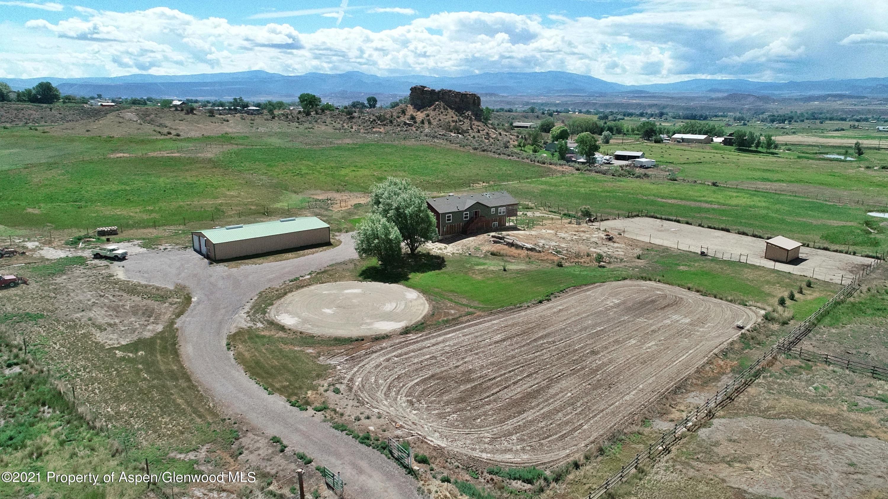 135 Swiss Lane Rifle, CO 81650 - Photo 2 of 46 an aerial view of a house with yard and big trees