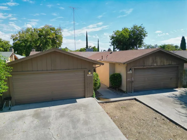 a house with a yard and garage