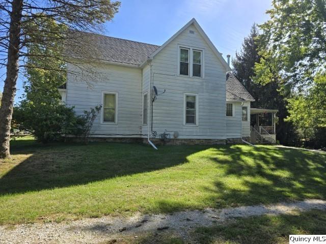 228 Wabash Avenue Carthage, IL 62321 - Photo 29 of 35 a front view of a house with a yard
