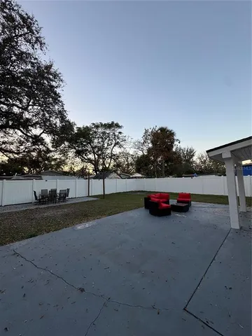 a view of a street with cars parked