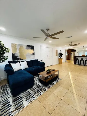a living room with furniture and a rug