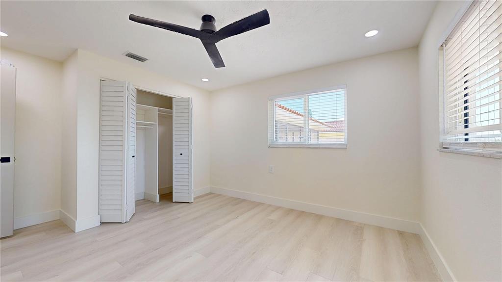 6380 3rd Palm Point St. Pete Beach, FL 33706 - Photo 27 of 48 an empty room with closet and windows