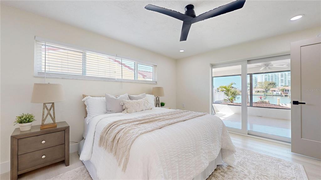 6380 3rd Palm Point St. Pete Beach, FL 33706 - Photo 33 of 48 a bedroom with a bed and a window