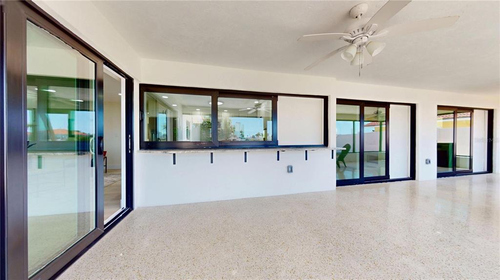 6380 3rd Palm Point St. Pete Beach, FL 33706 - Photo 35 of 48 wooden floor in an empty room with a large window