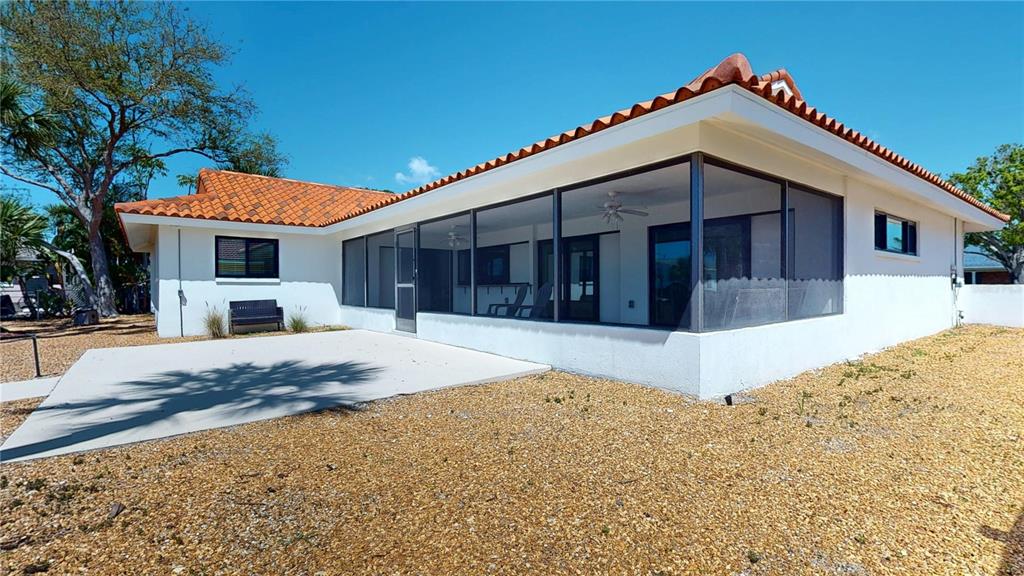 6380 3rd Palm Point St. Pete Beach, FL 33706 - Photo 36 of 48 a front view of a house with a yard