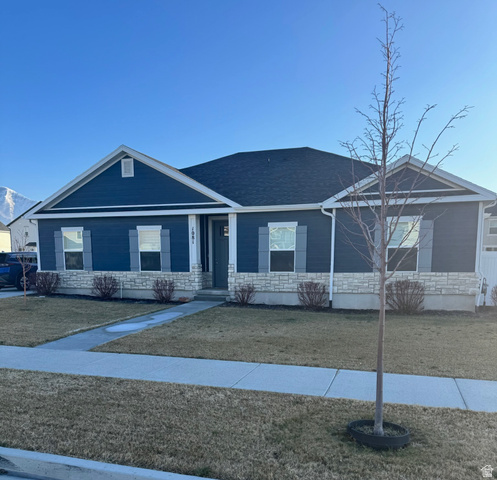 1081 West 1150th Street South Springville, UT 84663 - Photo 1 of 1 View of front of house featuring stone siding and a front lawn