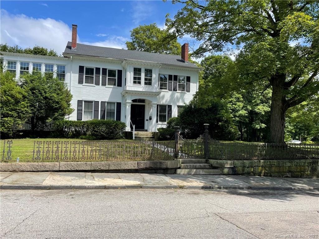 161 Broadway, Unit 2 Norwich, CT 06360 - Photo 1 of 1 a front view of a house with a garden