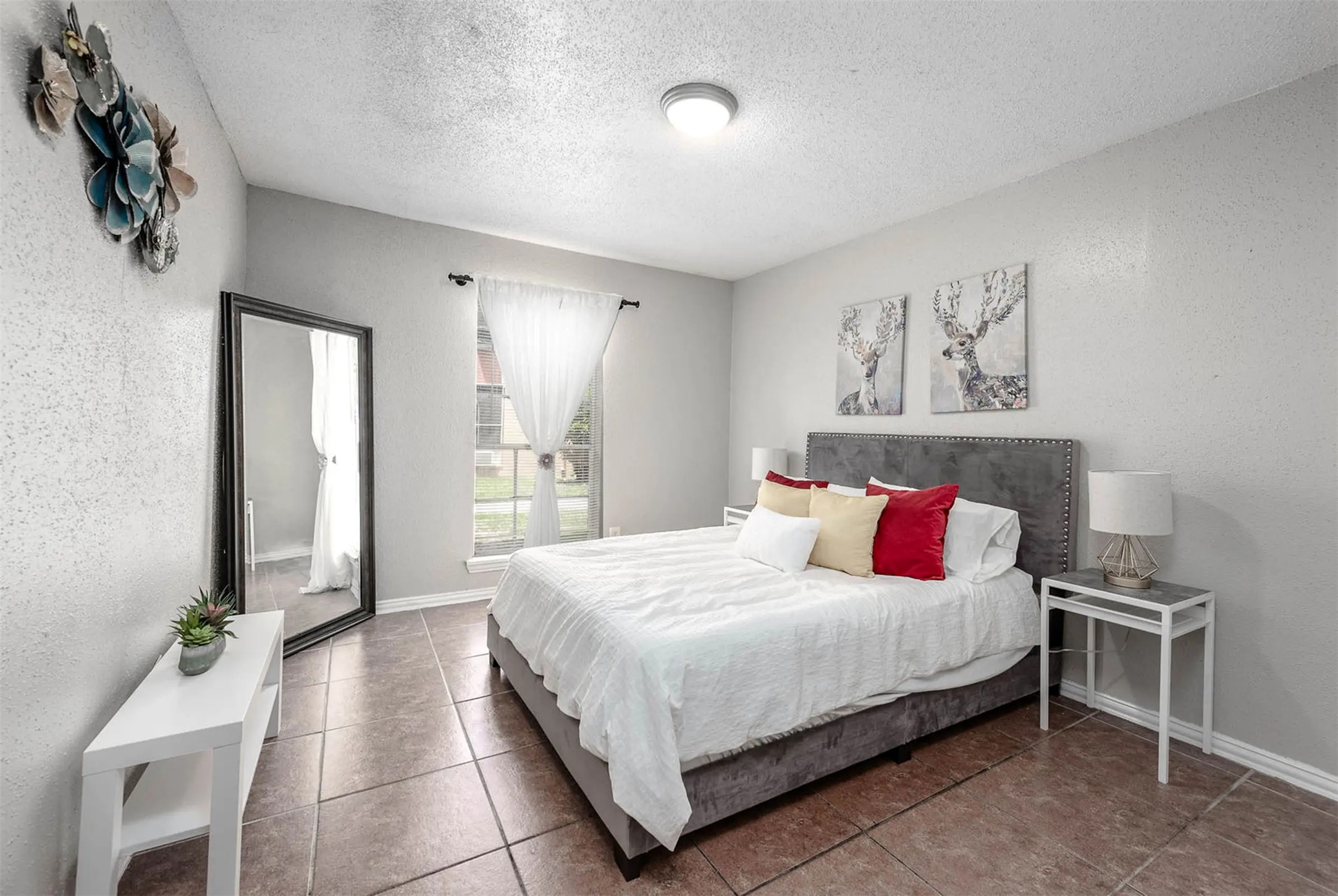 4300 Shaver Street, Unit 73 Houston, TX 77034 - Photo 3 of 8 a bedroom with a bed and a table