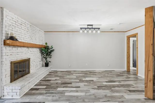 a view of empty room with fireplace