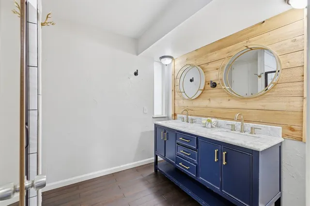 a bathroom with a sink and a mirror