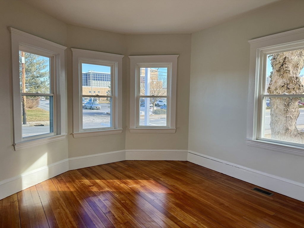 513 Slocum Road Dartmouth, MA 02747 - Photo 14 of 34 a view of empty room with wooden floor and fan