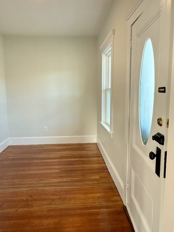 513 Slocum Road Dartmouth, MA 02747 - Photo 15 of 34 a view of a room with wooden floor and windows
