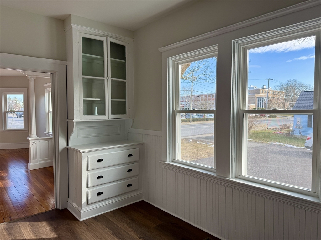 513 Slocum Road Dartmouth, MA 02747 - Photo 18 of 34 a view of wooden floor and windows in a room