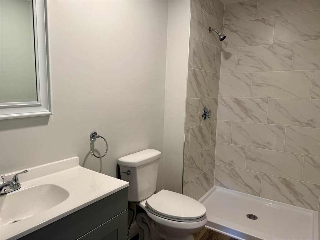 513 Slocum Road Dartmouth, MA 02747 - Photo 22 of 34 a bathroom with a sink a toilet and shower