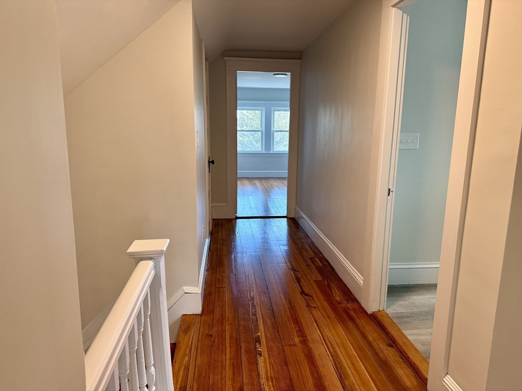 513 Slocum Road Dartmouth, MA 02747 - Photo 27 of 34 a view of a hallway with wooden floor