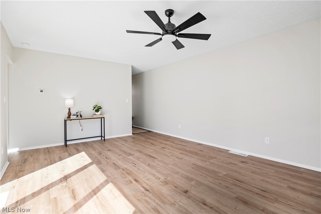 32969 Mills Road North Ridgeville, OH 44039 - Photo 6 of 29 Unfurnished room featuring ceiling fan and light hardwood / wood-style floors