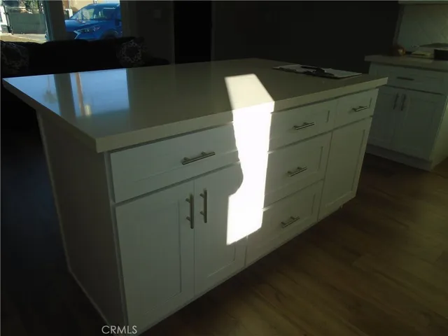 a utility room with cabinets washer and dryer