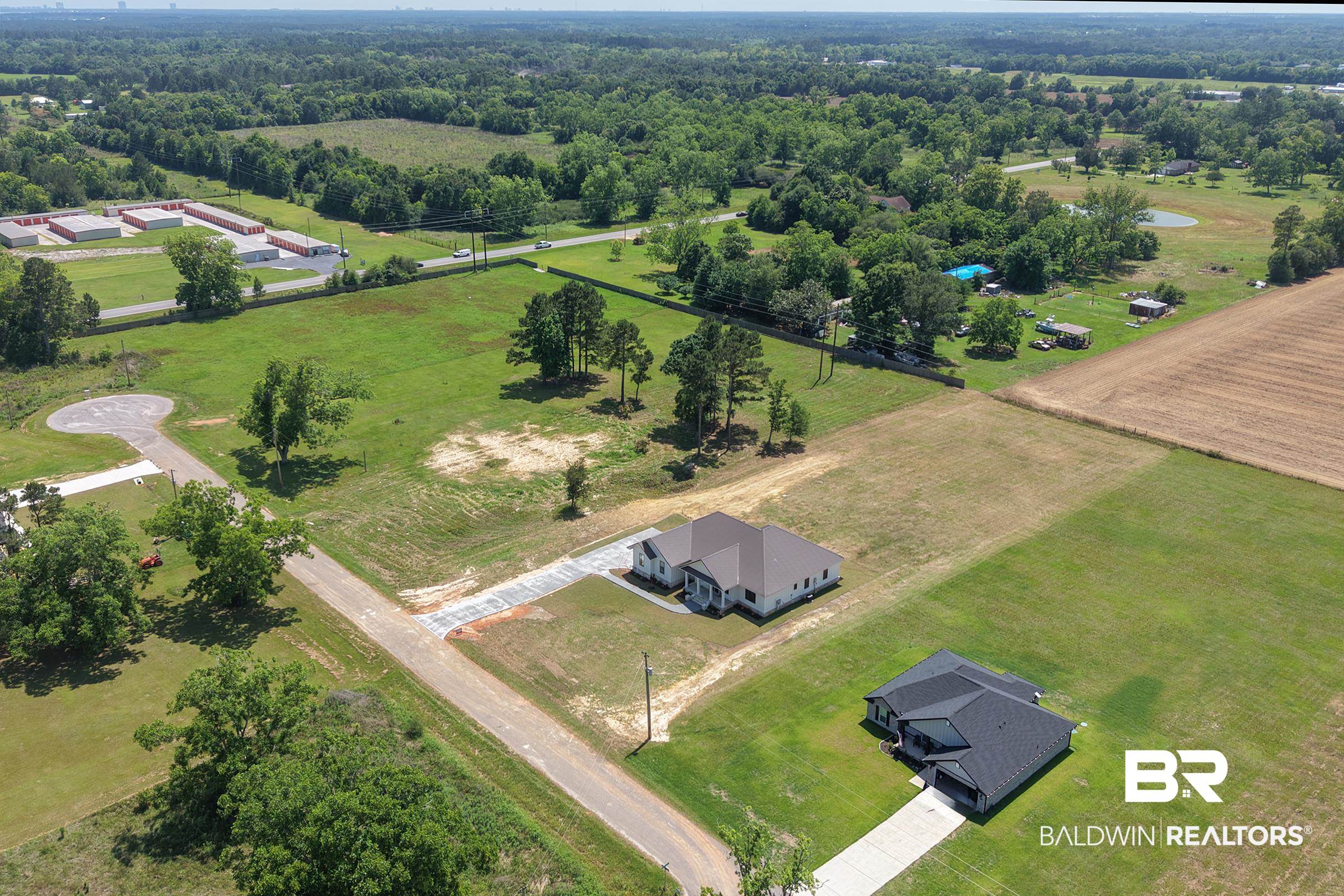 13111 Gopher Court Elberta, AL 36530 - Photo 2 of 41 New construction residential property featuring a light-colored exterior and a dark roof