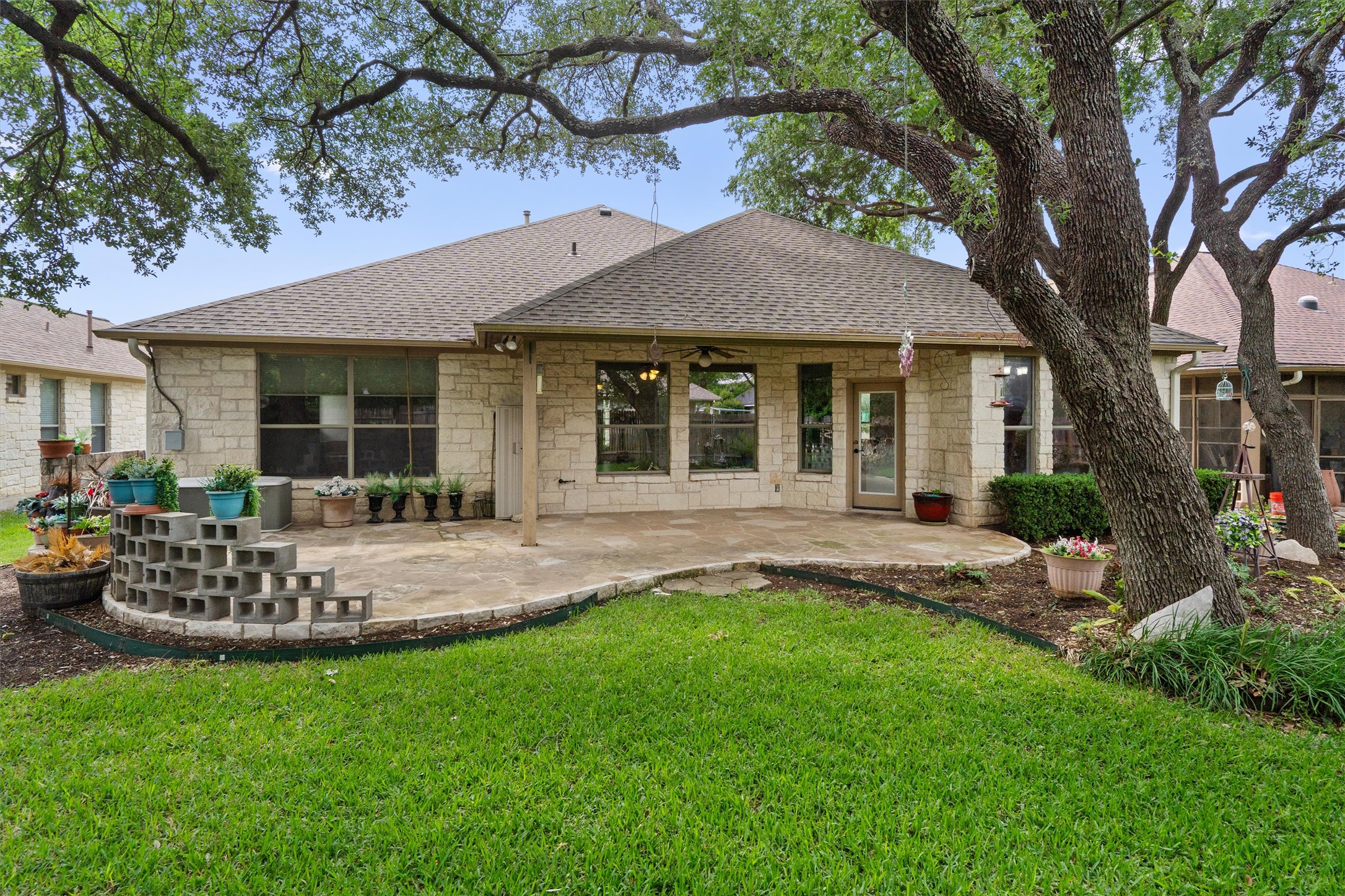 4612 Sonora Trace Georgetown, TX 78633 - Photo 7 of 36 a front view of a house with a garden and yard