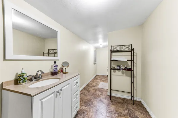 a bathroom with a sink and mirror