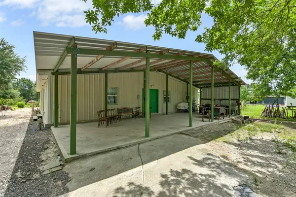 a house with trees in the background