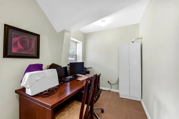 a workspace with furniture and a window