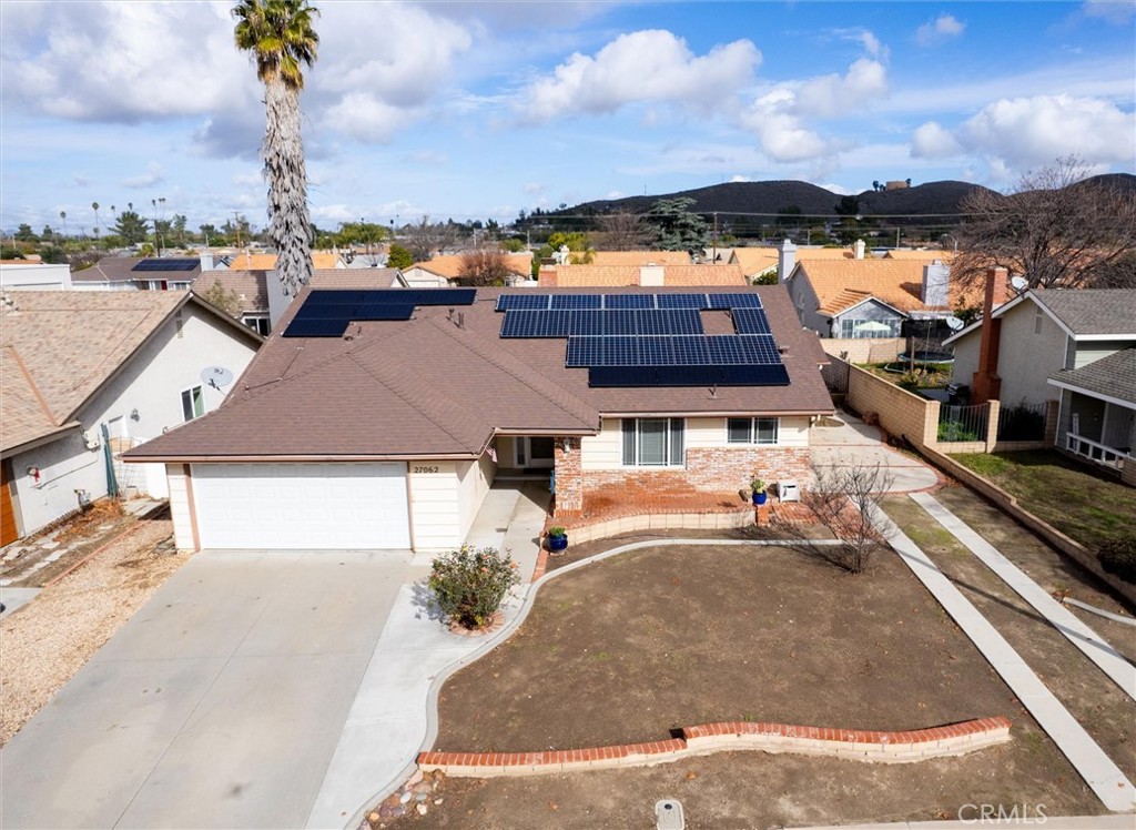an aerial view of a house with a garden