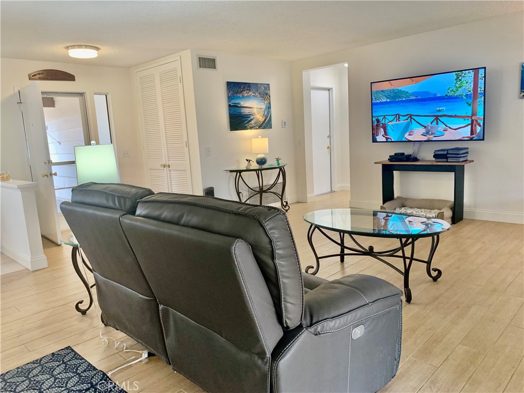 27062 Terrytown Road Menifee, CA 92586 - Photo 11 of 36 a living room with furniture and a flat screen tv