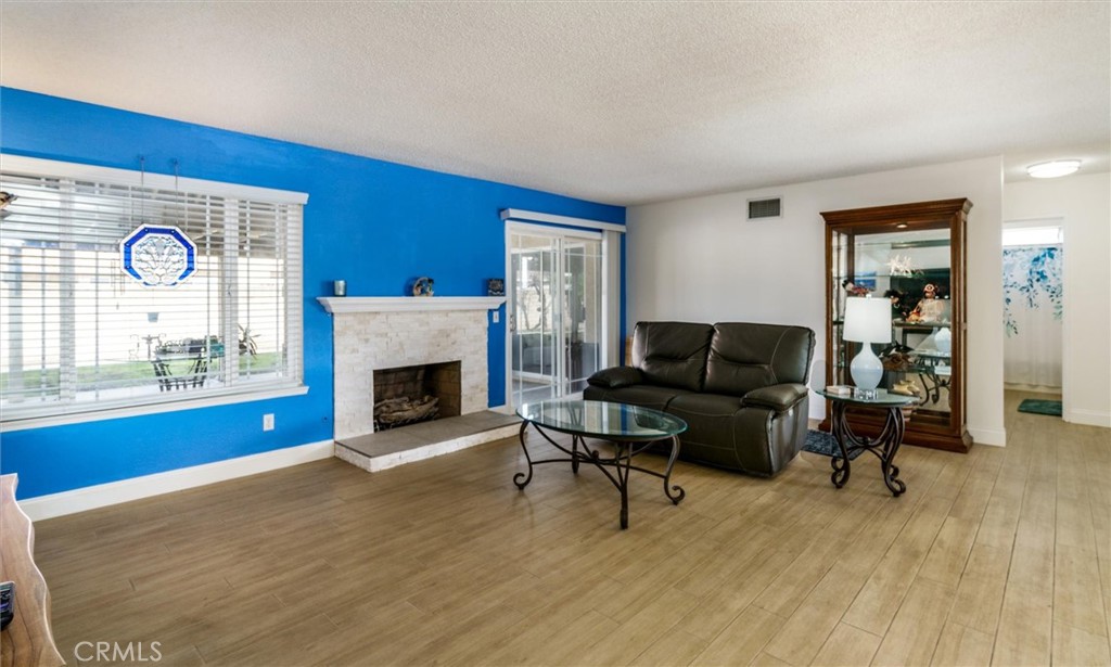 27062 Terrytown Road Menifee, CA 92586 - Photo 12 of 36 a living room with furniture and a fireplace