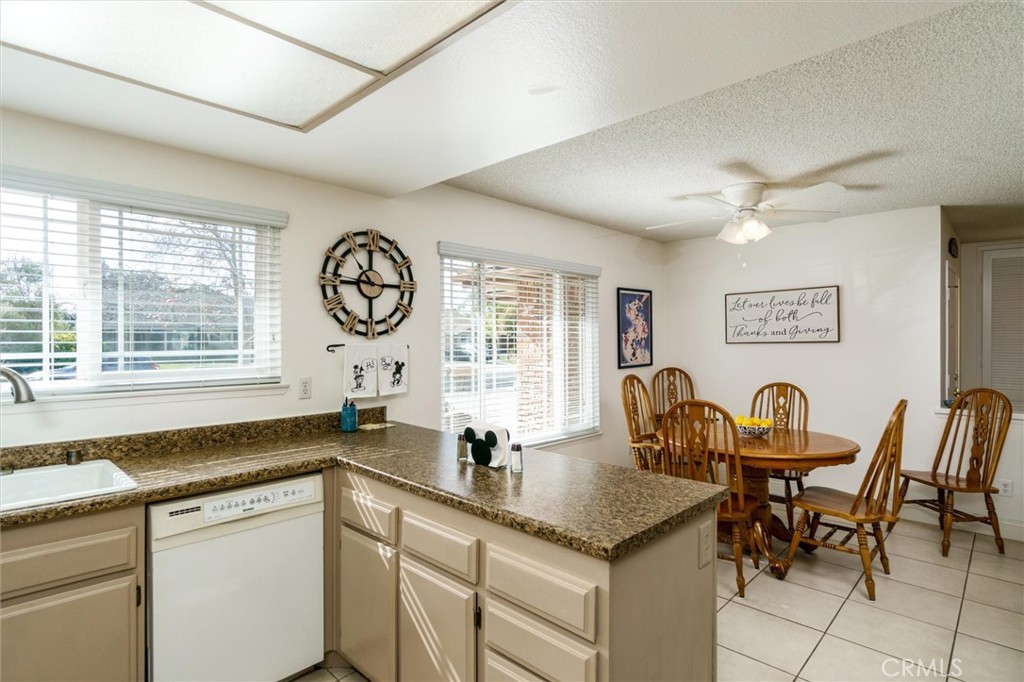 27062 Terrytown Road Menifee, CA 92586 - Photo 14 of 36 a dining hall with stainless steel appliances granite countertop furniture and a large window