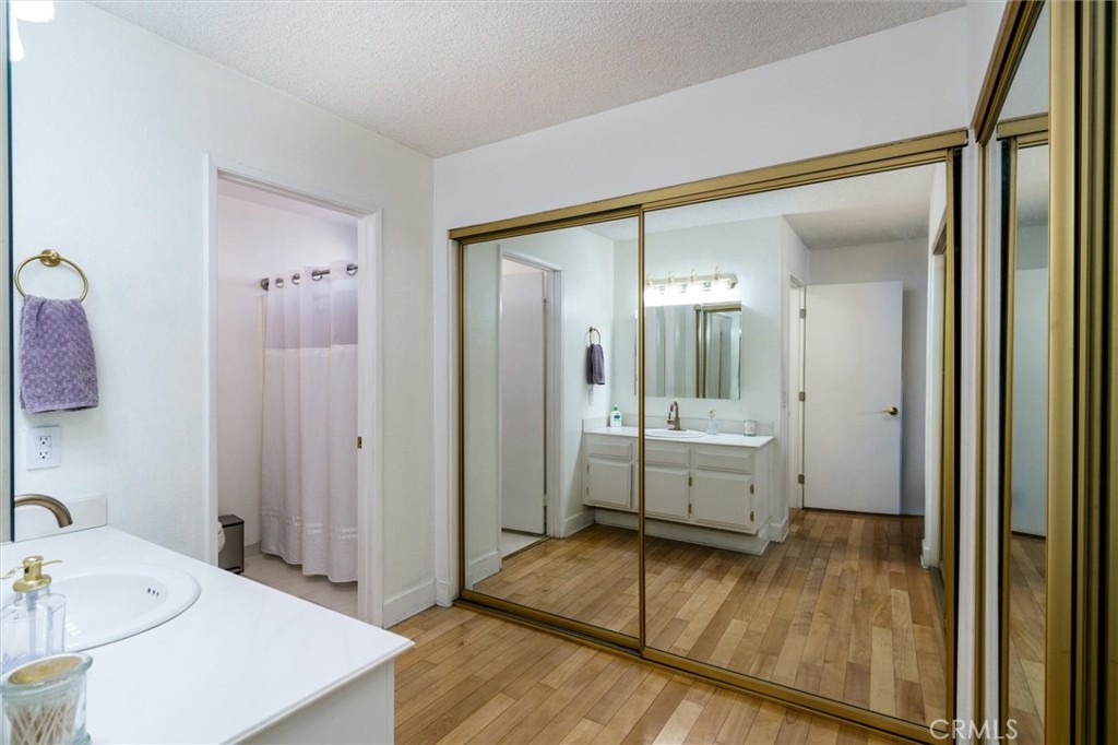 27062 Terrytown Road Menifee, CA 92586 - Photo 20 of 36 a spacious bathroom with a tub sink and mirror