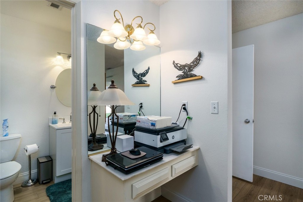 27062 Terrytown Road Menifee, CA 92586 - Photo 25 of 36 a dining room with wooden floor