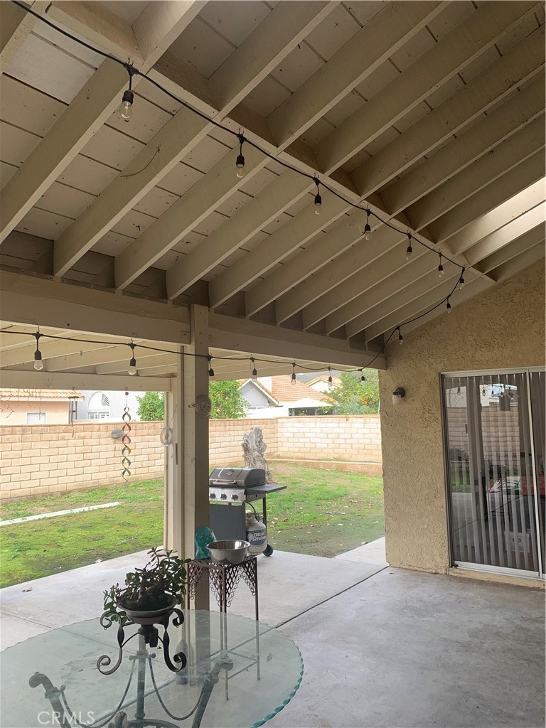 27062 Terrytown Road Menifee, CA 92586 - Photo 30 of 36 a view of a porch with furniture and garden