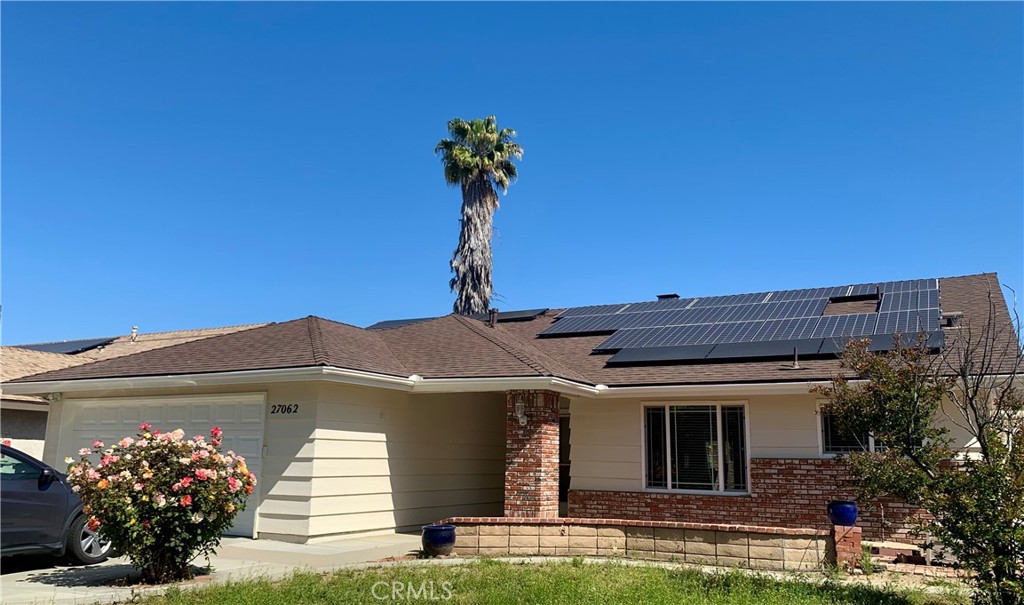 27062 Terrytown Road Menifee, CA 92586 - Photo 3 of 36 a front view of a house with a garden