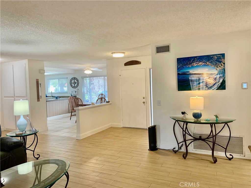 27062 Terrytown Road Menifee, CA 92586 - Photo 7 of 36 a view of a living room and dining room